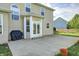Backyard patio with direct access to the house, plus a grill, and mature landscaping at 1306 Flat Wood Ct, Brownsburg, IN 46112