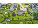 Aerial view of a sprawling backyard featuring mature trees, play equipment, and a patio at 1306 Flat Wood Ct, Brownsburg, IN 46112
