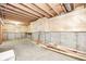 Unfinished basement with exposed wood beams and concrete walls, ready for customization at 1306 Flat Wood Ct, Brownsburg, IN 46112