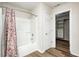 Bathroom with shower-tub combination and decorative shower curtain, plus a walk-in closet at 1306 Flat Wood Ct, Brownsburg, IN 46112
