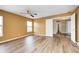 Bedroom with wood-look floors, yellow walls, and door to ensuite bath at 1306 Flat Wood Ct, Brownsburg, IN 46112