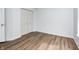 Bedroom displaying hardwood floors, light blue walls, and a double-door closet for ample storage at 1306 Flat Wood Ct, Brownsburg, IN 46112