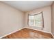 Cozy bedroom with neutral walls, hardwood floors, and a window providing natural light at 1306 Flat Wood Ct, Brownsburg, IN 46112