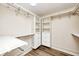 Walk-in closet is equipped with white shelving, drawers and clothing rods at 1306 Flat Wood Ct, Brownsburg, IN 46112