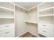 Walk-in closet features white shelving, drawers, and metal clothing rods at 1306 Flat Wood Ct, Brownsburg, IN 46112