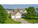 Two-story home featuring a two-car garage, well-manicured lawn and classic architectural details at 1306 Flat Wood Ct, Brownsburg, IN 46112