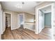 Bright hallway features wood-look floors and white railing leading to additional rooms at 1306 Flat Wood Ct, Brownsburg, IN 46112