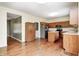Kitchen featuring wood cabinets, stainless steel appliances, hardwood floors, and ample counter space at 1306 Flat Wood Ct, Brownsburg, IN 46112
