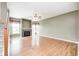 Spacious living room featuring hardwood floors, a fireplace, large windows and a ceiling fan at 1306 Flat Wood Ct, Brownsburg, IN 46112