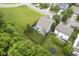 Aerial view of a backyard featuring a deck, patio, privacy fence, and a manicured lawn at 13817 Black Canyon Ct, Fishers, IN 46038