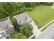 Aerial view of a charming two-story home with a spacious yard and mature trees in a quiet neighborhood at 13817 Black Canyon Ct, Fishers, IN 46038