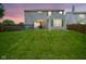 Spacious backyard with green lawn, deck, patio, and mature trees at 13817 Black Canyon Ct, Fishers, IN 46038