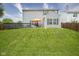 Spacious backyard with a deck, patio, and an orange umbrella at 13817 Black Canyon Ct, Fishers, IN 46038