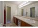 Well-lit bathroom with double sinks offers plenty of counter space and ample storage for toiletries at 13817 Black Canyon Ct, Fishers, IN 46038