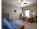 Bedroom with a futon, desk, file cabinet and ceiling fan for a flexible living space at 13817 Black Canyon Ct, Fishers, IN 46038