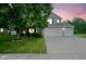 Charming home with a three-car garage, well-maintained lawn, and mature landscaping at 13817 Black Canyon Ct, Fishers, IN 46038