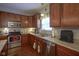 Kitchen with stainless steel appliances, wood cabinets, and ample counter space at 13817 Black Canyon Ct, Fishers, IN 46038