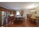 Modern kitchen featuring stainless steel appliances, large island, and open dining area, perfect for entertaining at 13817 Black Canyon Ct, Fishers, IN 46038