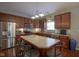 Modern kitchen with stainless steel appliances and a large island with seating at 13817 Black Canyon Ct, Fishers, IN 46038
