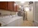 Well-equipped laundry room with appliances and ample storage cabinets at 13817 Black Canyon Ct, Fishers, IN 46038
