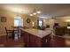 Open concept kitchen, dining and living room with wood floors and neutral colors at 13817 Black Canyon Ct, Fishers, IN 46038