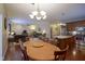 Spacious open concept living, dining and kitchen space with hardwood flooring at 13817 Black Canyon Ct, Fishers, IN 46038