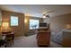Comfortable living room area with carpet, windows, a ceiling fan, and seating at 13817 Black Canyon Ct, Fishers, IN 46038