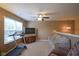 Inviting living room featuring carpet, windows, ceiling fan, and media center at 13817 Black Canyon Ct, Fishers, IN 46038