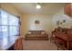 Cozy living area featuring a comfortable sofa, classic piano, and plenty of natural light at 13817 Black Canyon Ct, Fishers, IN 46038