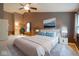 Tranquil main bedroom featuring neutral colors, ample natural light, and a ceiling fan at 13817 Black Canyon Ct, Fishers, IN 46038