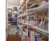 Organized pantry with stocked shelves, providing ample storage for all your kitchen essentials at 13817 Black Canyon Ct, Fishers, IN 46038