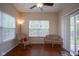 Bright sunroom with two windows, a ceiling fan and patio door leading to the backyard at 13817 Black Canyon Ct, Fishers, IN 46038