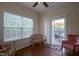 Sunroom featuring two windows, a sliding glass door to a deck with outdoor seating at 13817 Black Canyon Ct, Fishers, IN 46038
