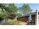 Spacious backyard featuring a patio with table and chairs, garden, and privacy fence at 1422 Dallas Dr, Plainfield, IN 46168