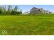 Large, fenced backyard ideal for recreation, with the home's exterior visible at 14350 Ludwell Ct, Fishers, IN 46037