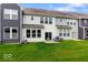 Relaxing backyard with a patio, grill, and green lawn at 14350 Ludwell Ct, Fishers, IN 46037