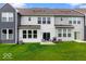 Backyard with a patio, chairs, grill, and manicured lawn at 14350 Ludwell Ct, Fishers, IN 46037