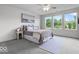 Bright bedroom with large windows, soft carpet, and modern decor at 14350 Ludwell Ct, Fishers, IN 46037