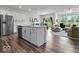 Open concept kitchen with stainless steel appliances, an island, with view of the dining and living area at 14350 Ludwell Ct, Fishers, IN 46037