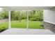 Covered back porch offering a tranquil view of the lush, green backyard and trees at 1510 Stonehaven Dr, Westfield, IN 46074