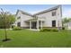 Spacious backyard with healthy green lawn, a patio, and exterior view of the home at 1510 Stonehaven Dr, Westfield, IN 46074