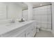 Bathroom featuring a dual sink vanity with quartz countertops, and shower with stylish curtain at 1510 Stonehaven Dr, Westfield, IN 46074
