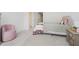 Neutral bedroom featuring plush carpet, soft pink accents, and an attached bathroom at 1510 Stonehaven Dr, Westfield, IN 46074