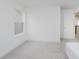 Bedroom showcasing neutral walls, plush carpeting, natural light, and an open doorway at 1510 Stonehaven Dr, Westfield, IN 46074
