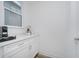 Bright coffee bar area with white cabinetry, light countertops, and a window for natural light at 1510 Stonehaven Dr, Westfield, IN 46074
