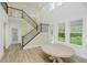 Bright dining room with high ceilings, staircase, and views of the outdoors at 1510 Stonehaven Dr, Westfield, IN 46074