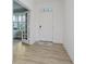 Bright foyer featuring light-colored wood floors, white walls, and a view into the light-filled sunroom at 1510 Stonehaven Dr, Westfield, IN 46074