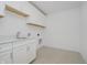 Efficient laundry room with white cabinetry, sink, quartz countertop, and tile flooring at 1510 Stonehaven Dr, Westfield, IN 46074