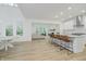 Open concept living space featuring an island with barstool seating, and an adjacent living room at 1510 Stonehaven Dr, Westfield, IN 46074