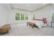 Bright main bedroom featuring plush carpet, large windows with backyard views, and modern furnishings at 1510 Stonehaven Dr, Westfield, IN 46074